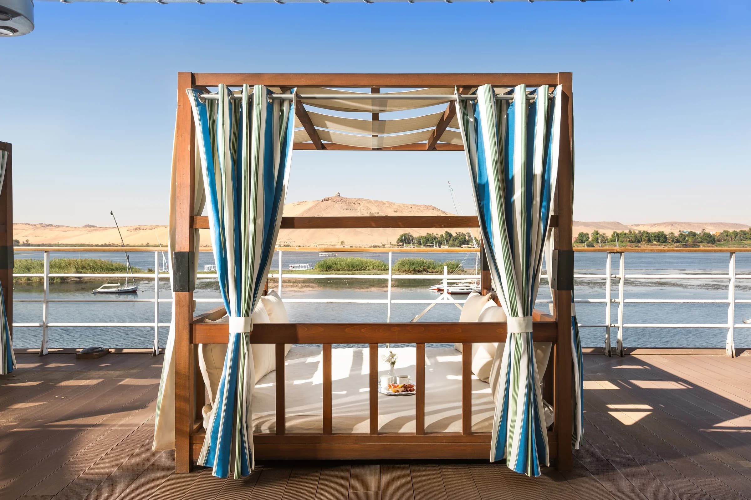 Canopied daybed on the deck of the M/Y Alyssa